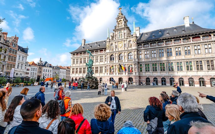 Tour group in front of Antwerp City Hall in Grote Markt, Antwerp, Belgium.
