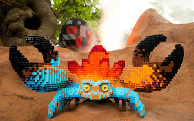 Lego crab sculpture at Legoland Windsor with colorful blocks and natural backdrop.