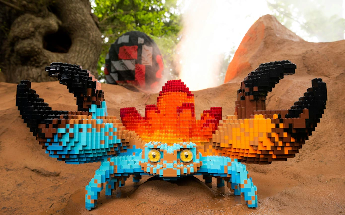 Lego crab sculpture at Legoland Windsor with colorful blocks and natural backdrop.
