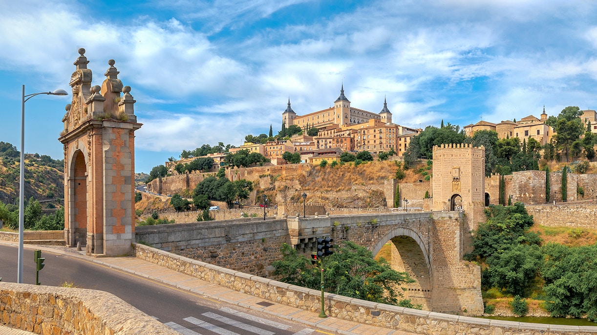 Alcazar and San Martin Bridge in Toledo with historic architecture and scenic landscape.