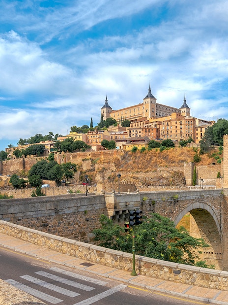 Alcazar and San Martin Bridge in Toledo with historic architecture and scenic landscape.