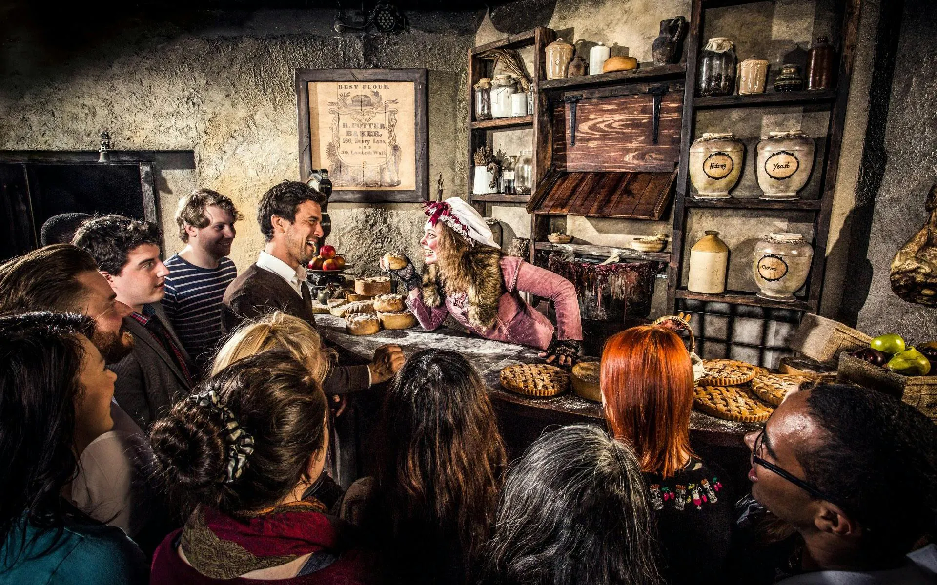 Guests interacting with a performer at the London Dungeon VIP Package experience.