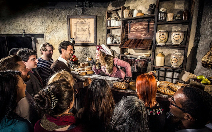 Guests interacting with a performer at the London Dungeon VIP Package experience.