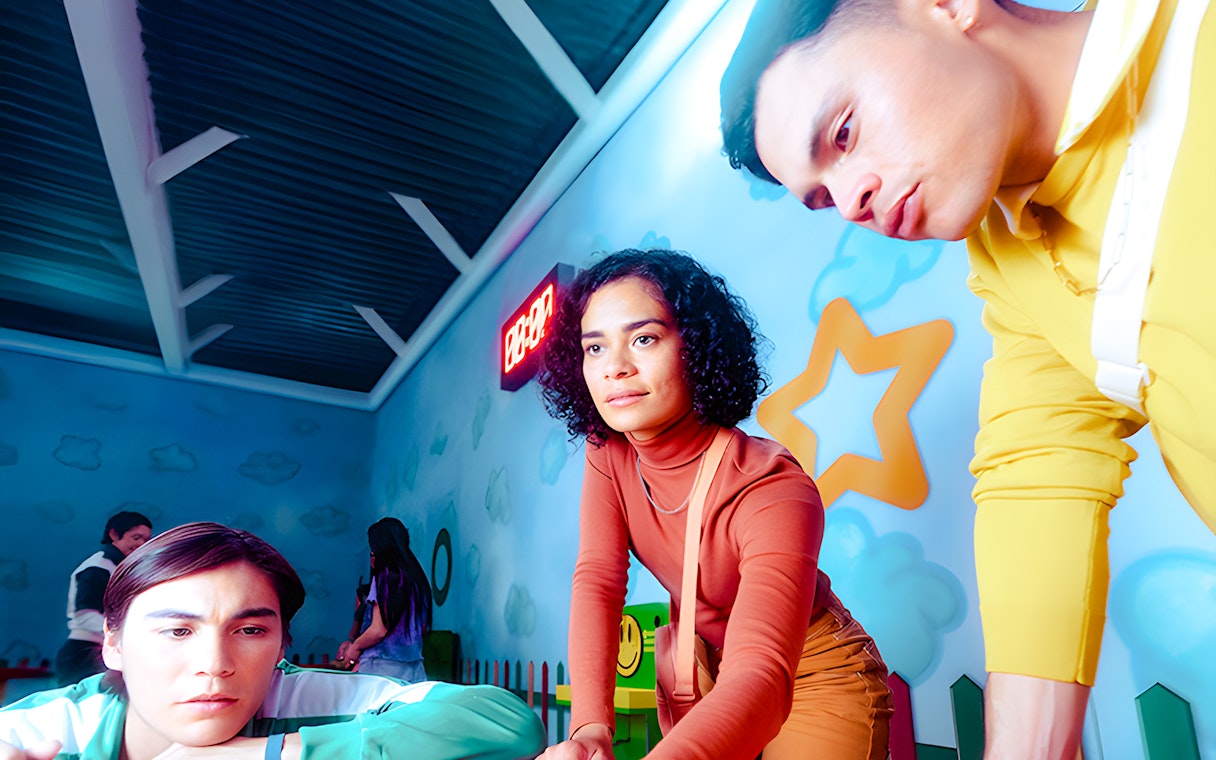 Participants engaging in a Squid Game-themed challenge at the London experience.