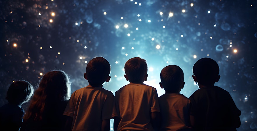 Children gazing at stars inside Peter Harrison Planetarium, Royal Observatory Greenwich.
