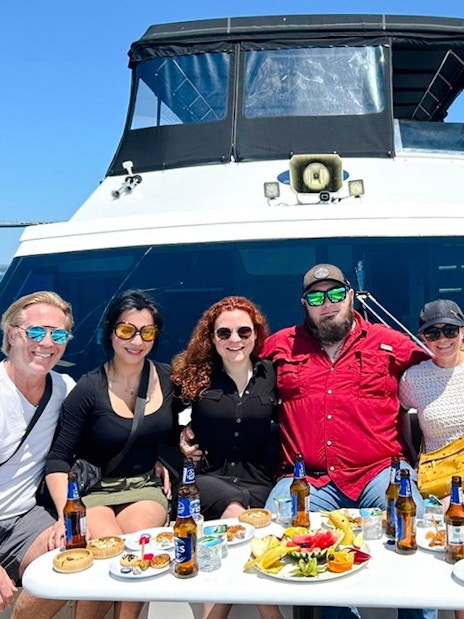 Group enjoying Bosphorus Yacht Sightseeing Cruise with snacks and drinks, Istanbul.