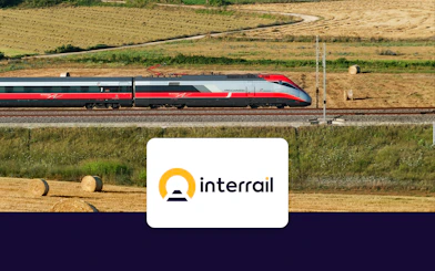 High-speed train traveling through countryside fields, Interrail Global Continuous Pass.