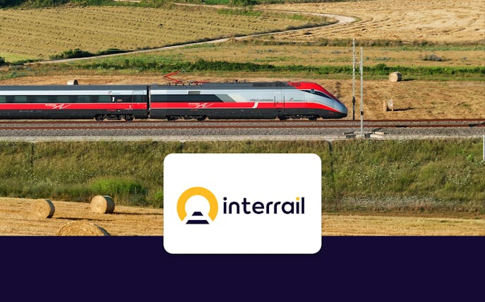 High-speed train traveling through countryside fields, Interrail Global Continuous Pass.