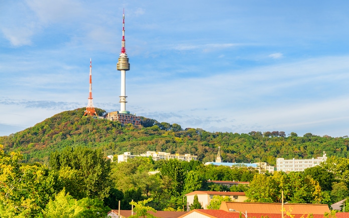 Namsan Seoul Tower on a green hill in Seoul, South Korea.