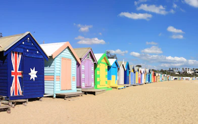 Colorful beach huts at Brighton Beach, Melbourne, part of Puffing Billy Steam Train & Penguin Parade Day Tour.