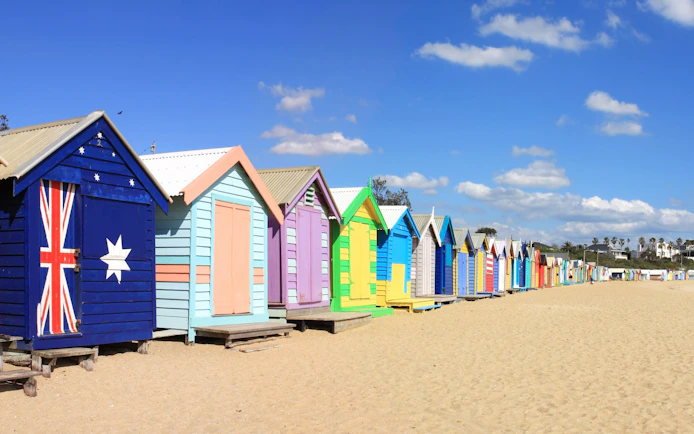 Colorful beach huts at Brighton Beach, Melbourne, part of Puffing Billy Steam Train & Penguin Parade Day Tour.