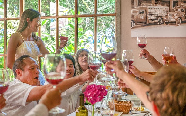 Group toasting with wine during Santiago de Compostela tour.