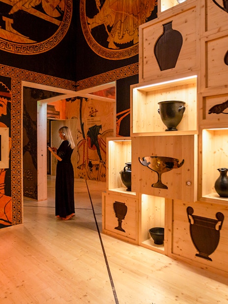 Visitors exploring wine exhibits at Cité du Vin museum in Bordeaux, France.
