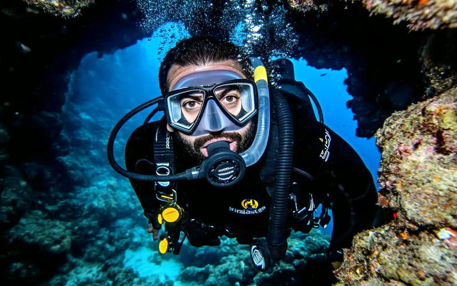 Diver exploring coral reef in Hurghada during sunset intro dive.