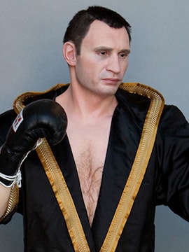 Boxer wax figure in black robe at Panoptikum.