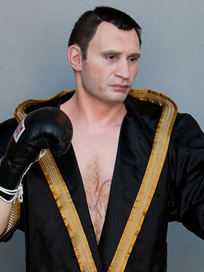 Boxer wax figure in black robe at Panoptikum.