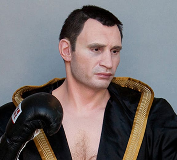 Boxer wax figure in black robe at Panoptikum.