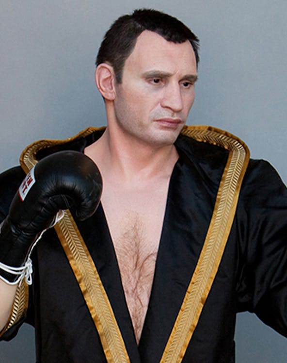 Boxer wax figure in black robe at Panoptikum.