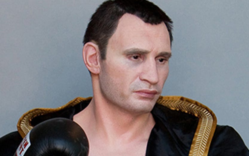Boxer wax figure in black robe at Panoptikum.