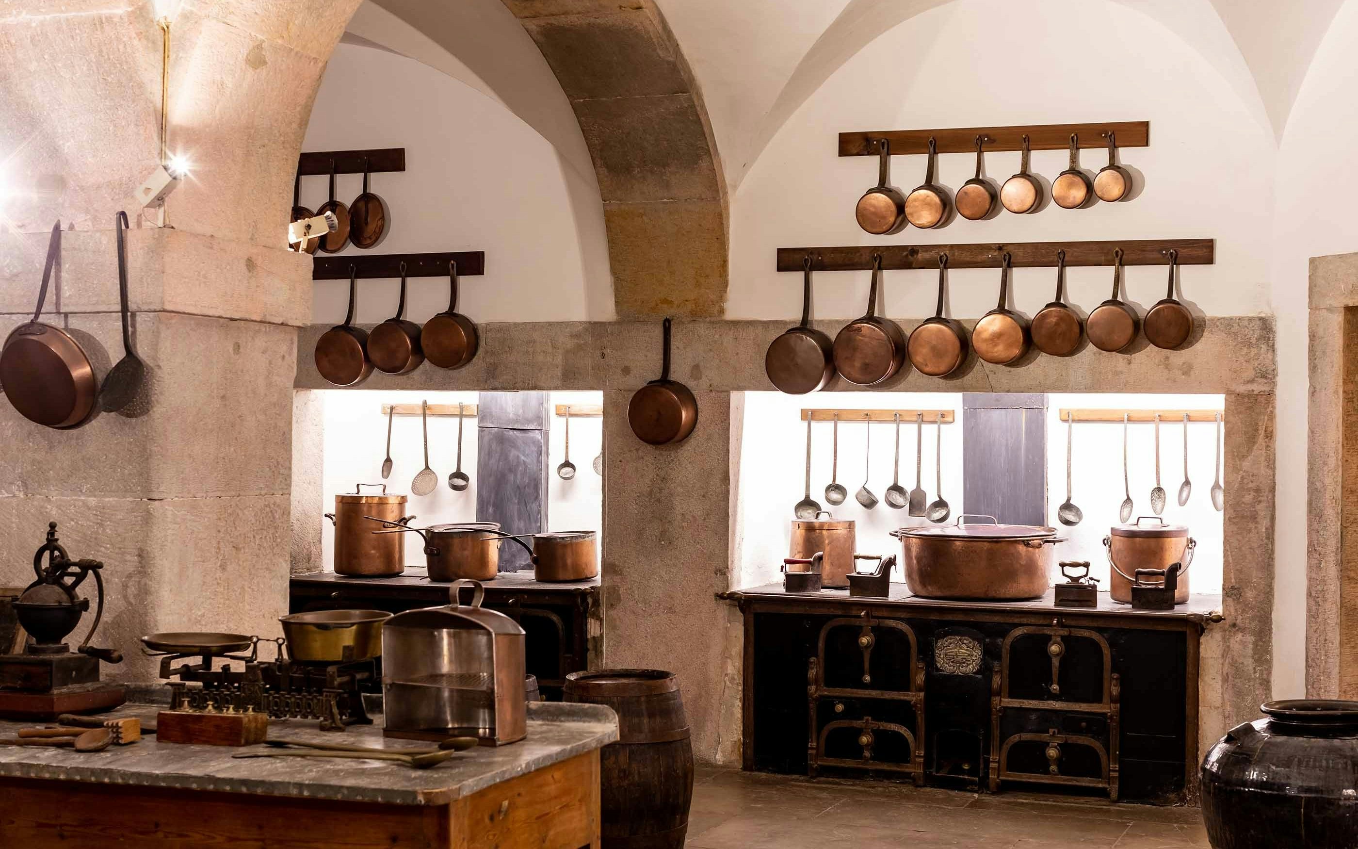 Copper cookware in the historic kitchen of Pena Palace, Sintra.