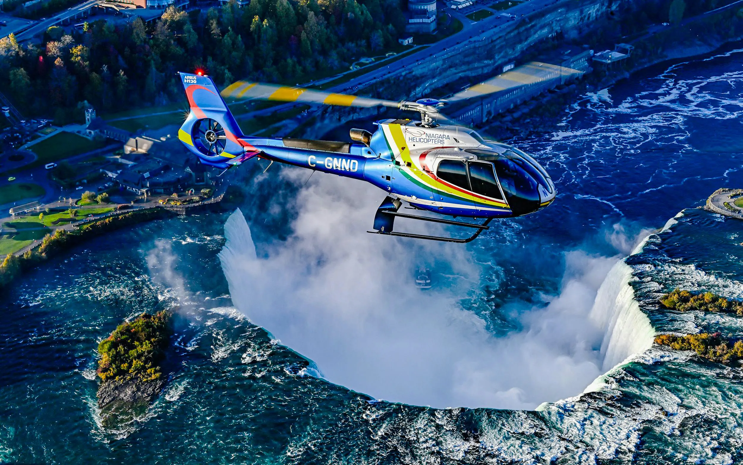 Helicopter flying over Niagara Falls in Canada.