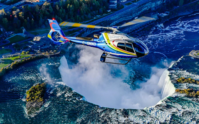 Helicopter flying over Niagara Falls in Canada.