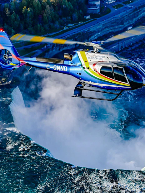 Helicopter flying over Niagara Falls in Canada.