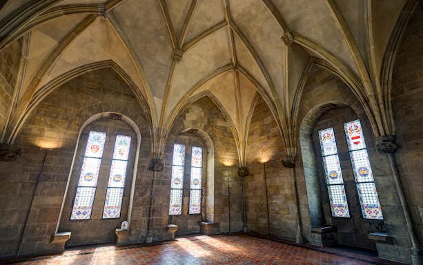 Stained glass windows and vaulted ceiling inside Powder Tower, Prague.