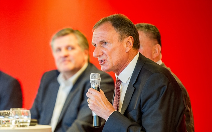 Former Liverpool FC player speaking at a Q&A session during the stadium tour.
