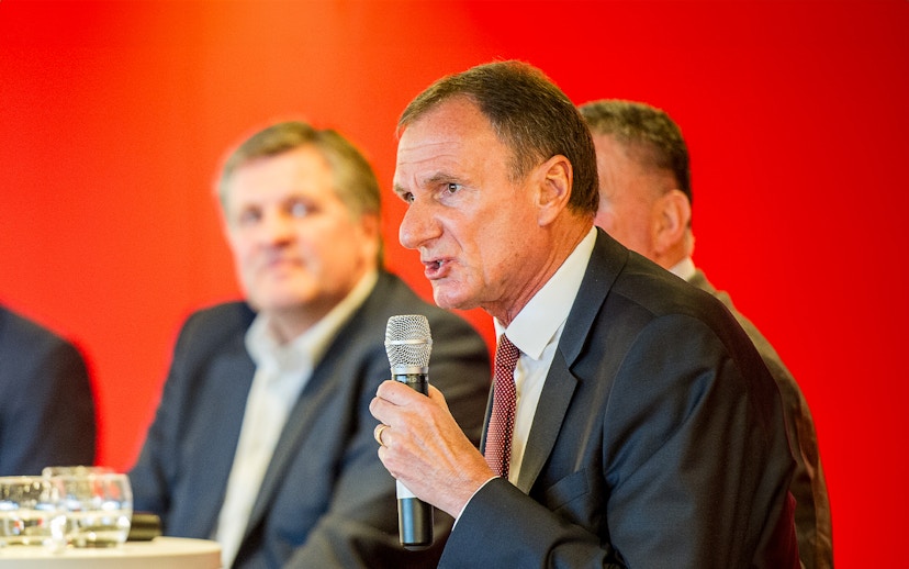 Former Liverpool FC player speaking at a Q&A session during the stadium tour.