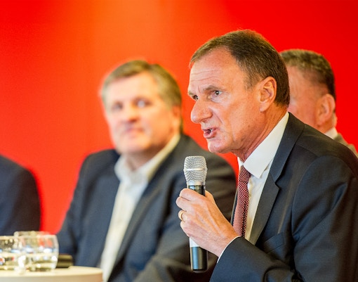 Former Liverpool FC player speaking at a Q&A session during the stadium tour.