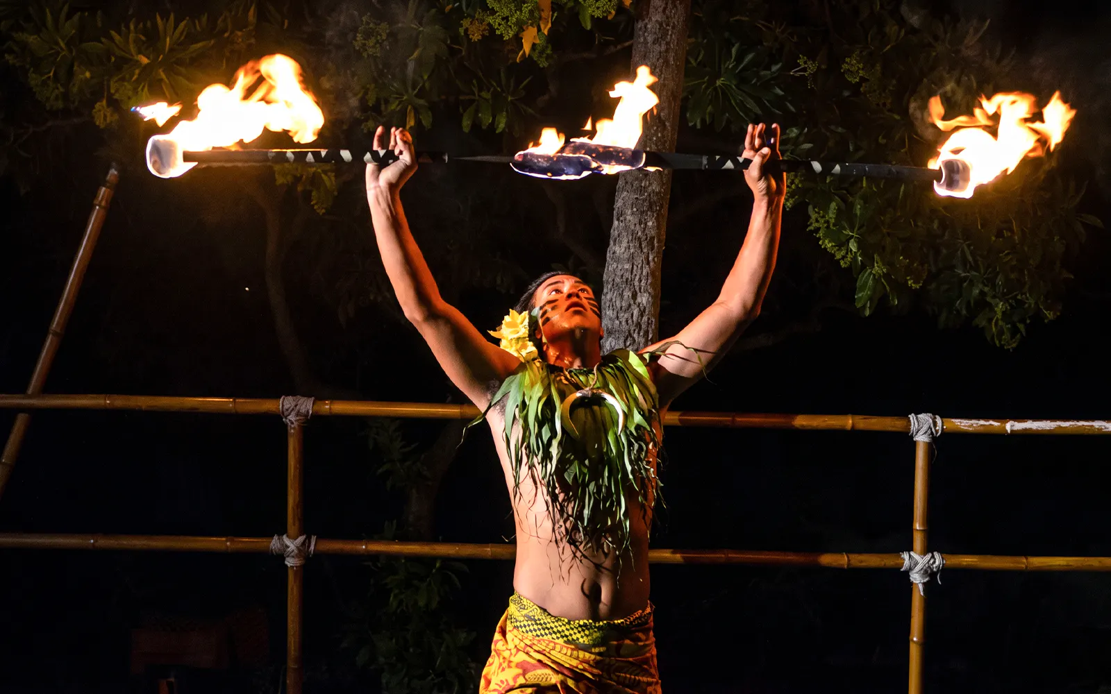 Performer with flaming baton at Voyagers of the Pacific Luau.