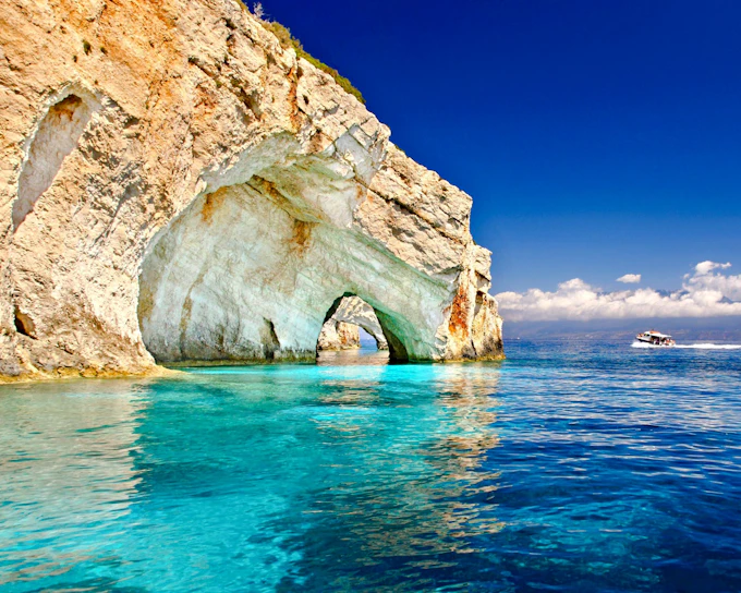 Poros Port Full-Day Cruise to Navagio Shipwreck and Blue Caves with Alykanas Visit