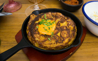Spanish tortilla with sauce served during Pablo Neruda tour lunch.