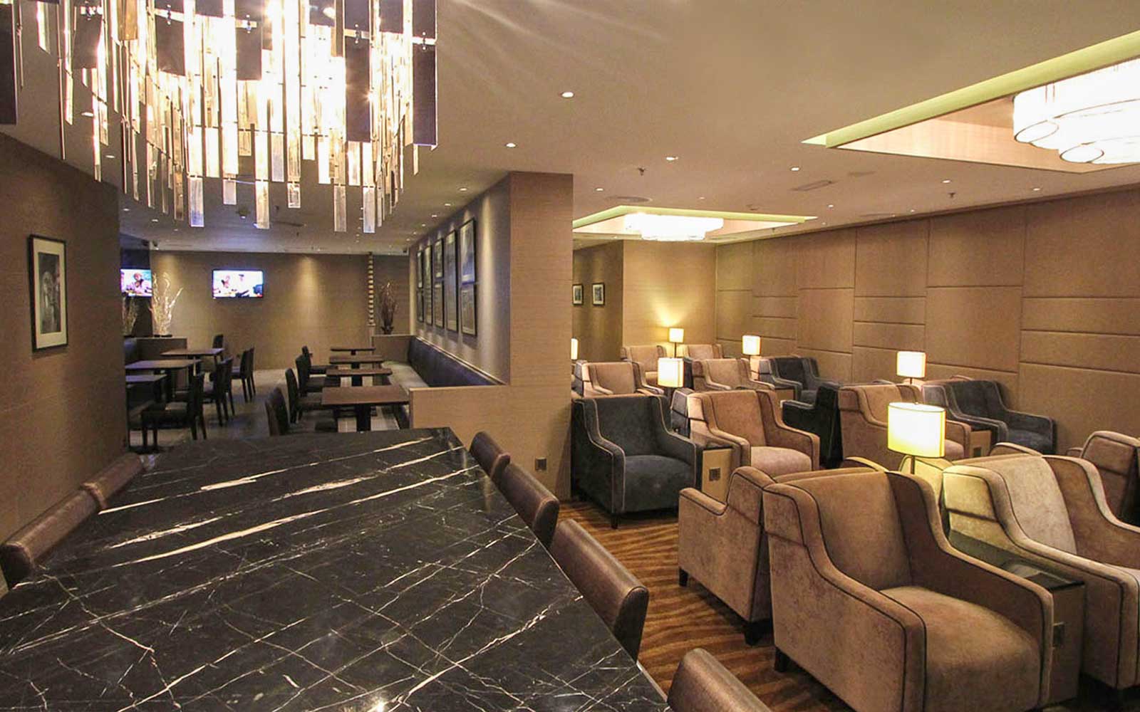 Plaza Premium Lounge seating area with modern decor and ambient lighting.