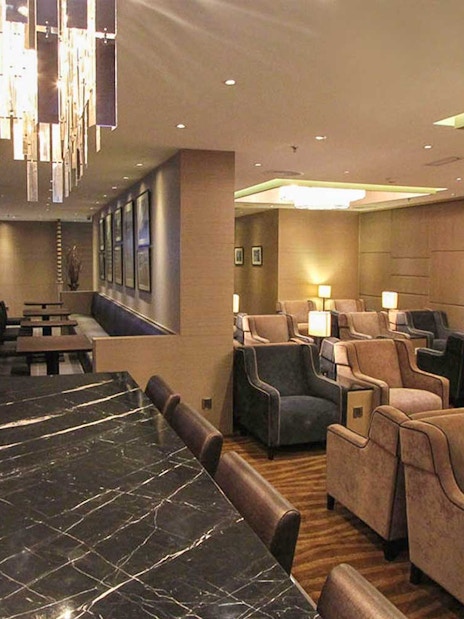 Plaza Premium Lounge seating area with modern decor and ambient lighting.