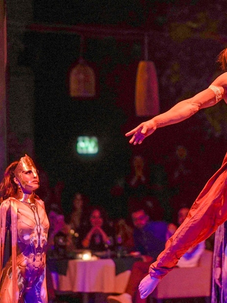 Performer suspended in air during Nouba Marrakech show.