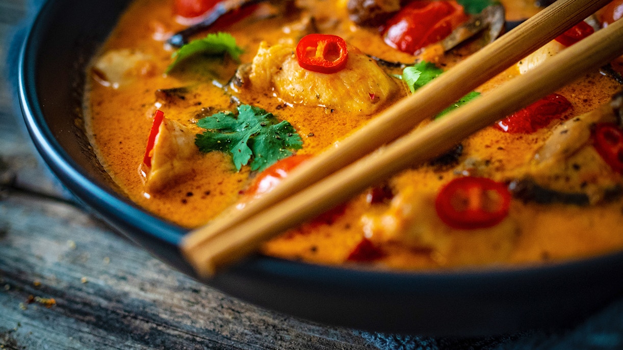 A close up of a Thai noodle soup