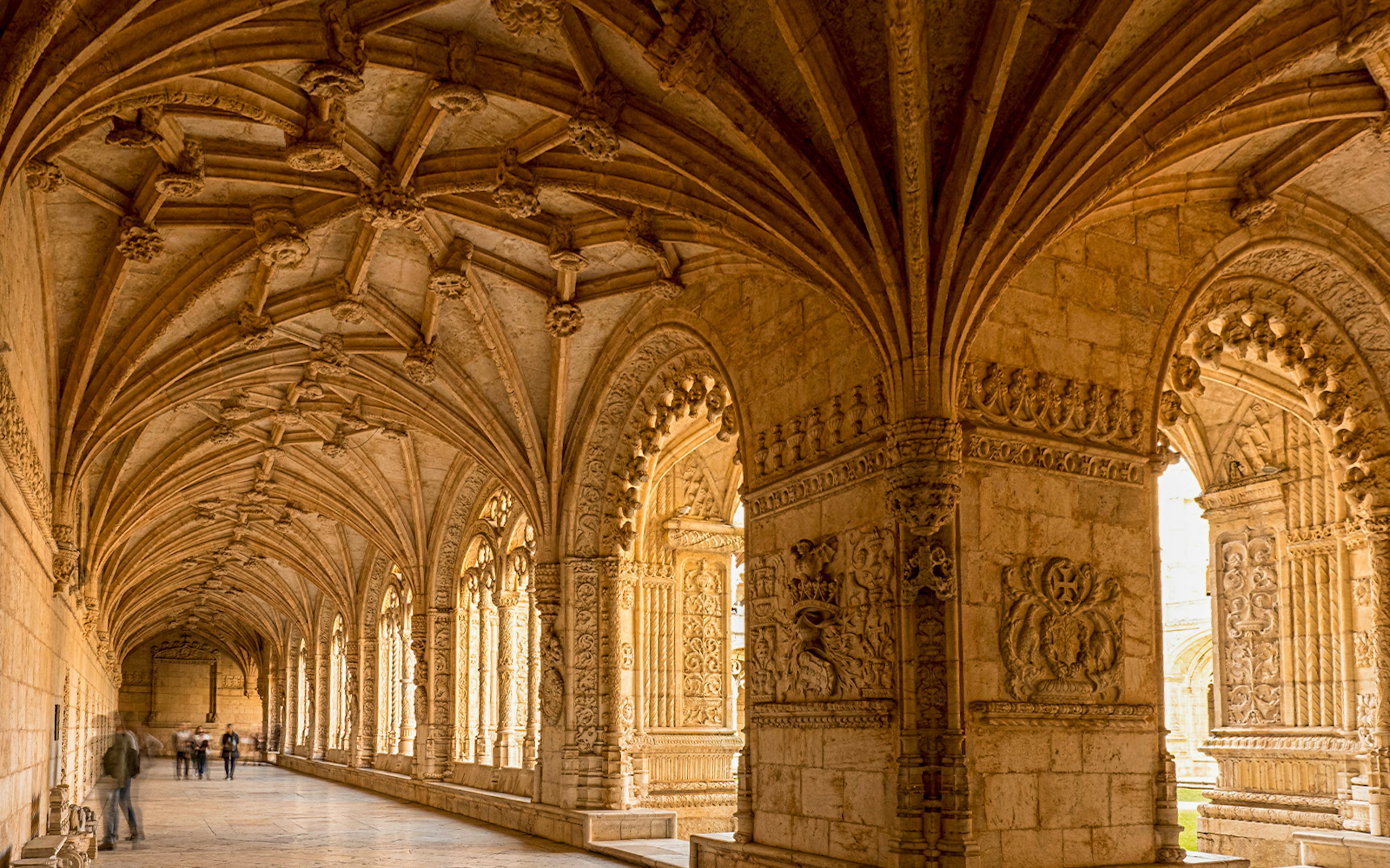 Jeronimos Monastery cloister with intricate vaulted ceiling, Lisbon, Portugal.