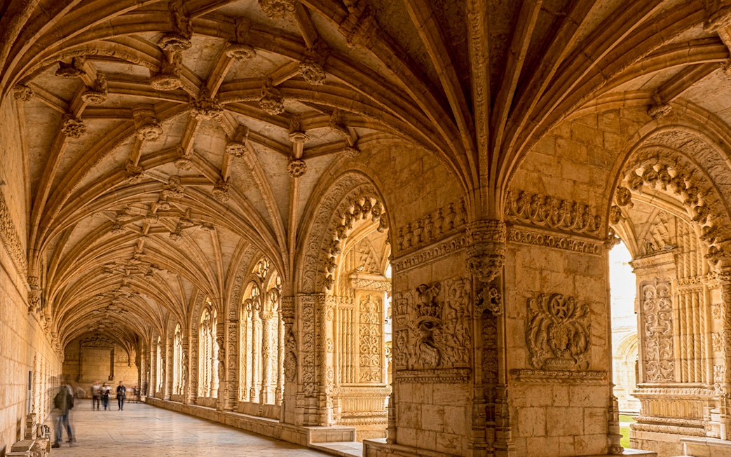 Jeronimos Monastery cloister with intricate vaulted ceiling, Lisbon, Portugal.
