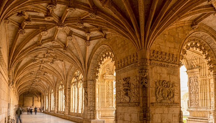 Jeronimos Monastery ceiling with intricate stone carvings in Lisbon, Portugal.