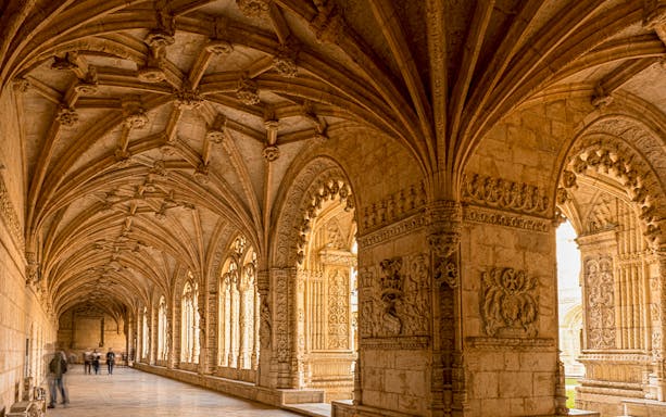 Jeronimos Monastery cloister with intricate vaulted ceiling, Lisbon, Portugal.