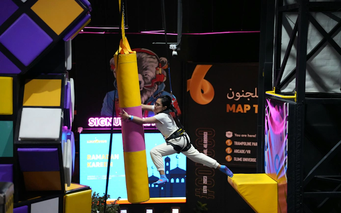 Wall climbing activity at Loco Bear indoor adventure park, Dubai.