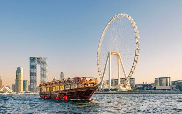 Dhow cruise near Dubai Marina with Ain Dubai Ferris wheel in the background.