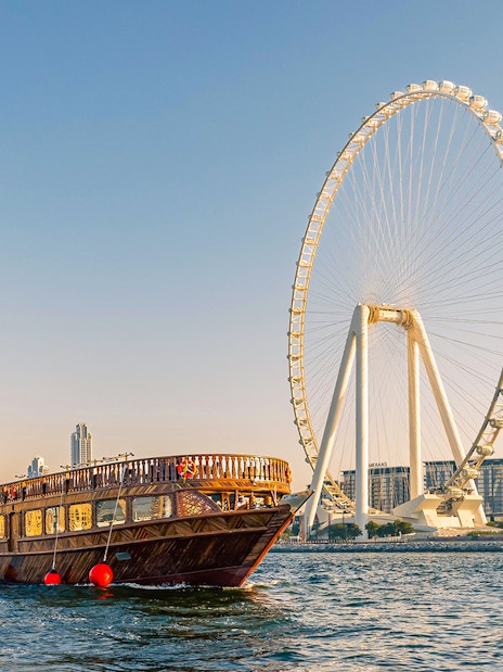 Dhow cruise near Dubai Marina with Ain Dubai Ferris wheel in the background.