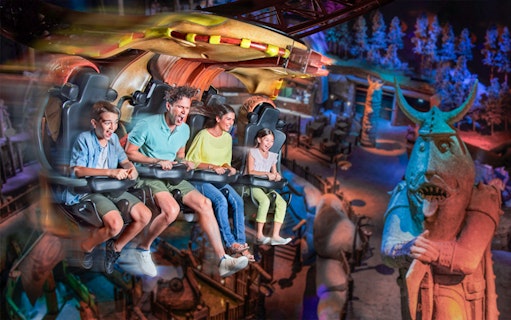 Visitors enjoying a thrilling ride at MOTIONGATE™ Dubai theme park.