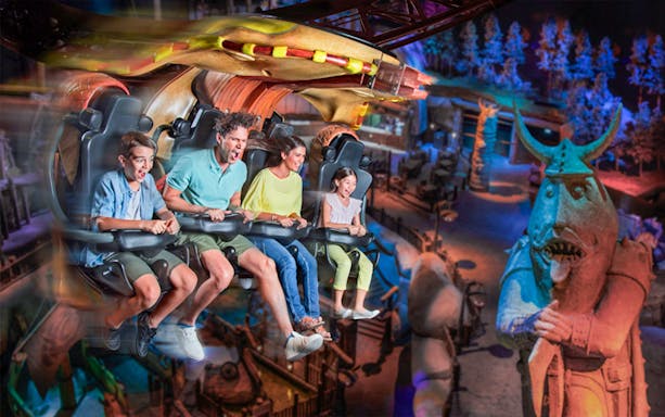 Visitors enjoying a thrilling ride at MOTIONGATE™ Dubai theme park.