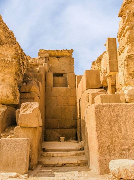 Ancient stone entrance at Giza Pyramids, Cairo, Egypt.