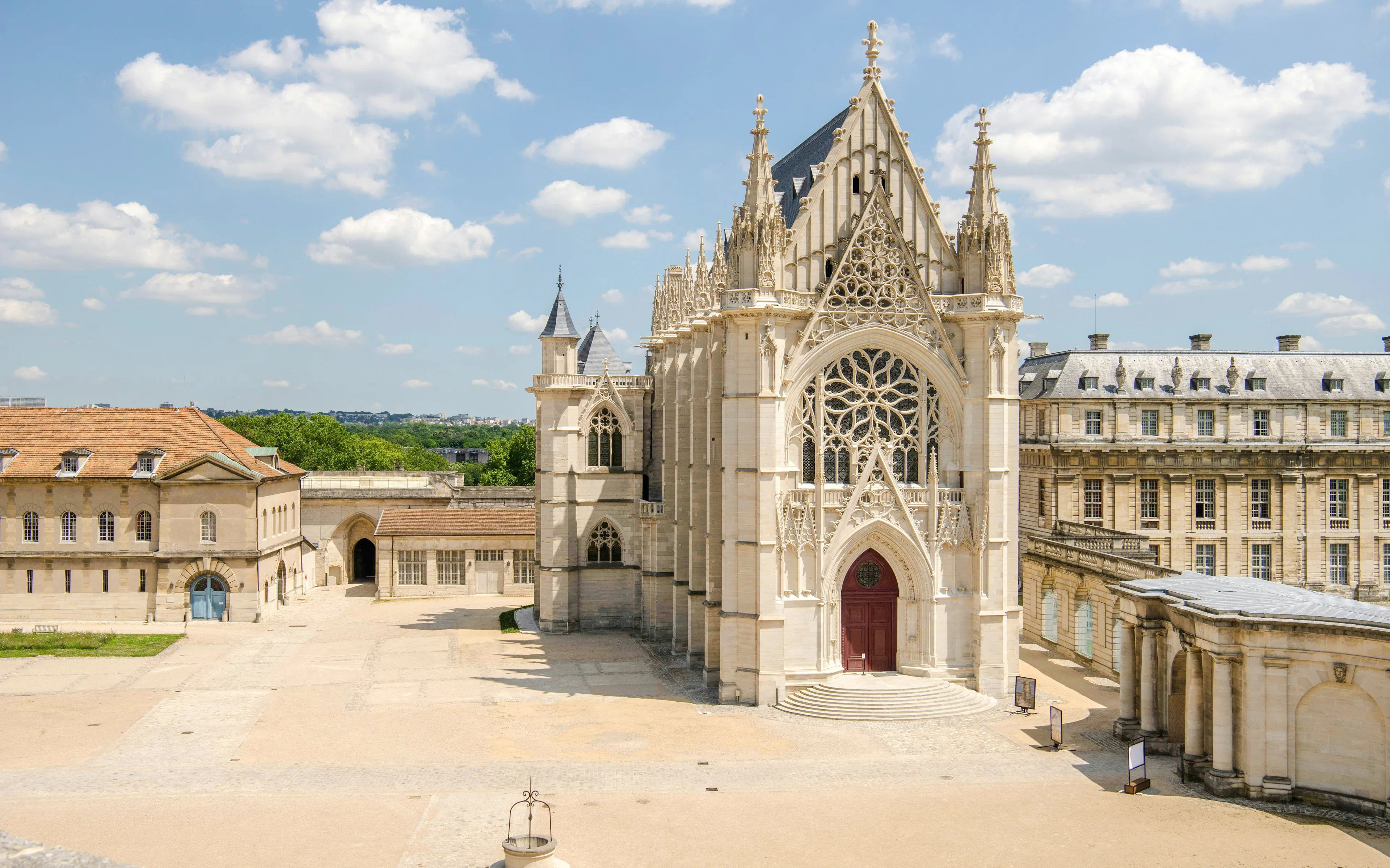 Château de Vincennes western façade with intricate rose window in Paris, France.