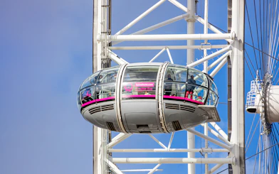 London Eye capsule with passengers enjoying views, part of Tower of London and London Eye combo tour.